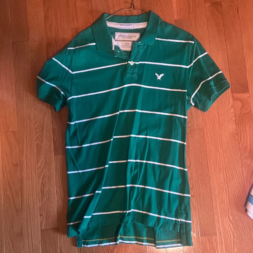 Medium-sized green and white striped American Eagle polo. Perfect condition